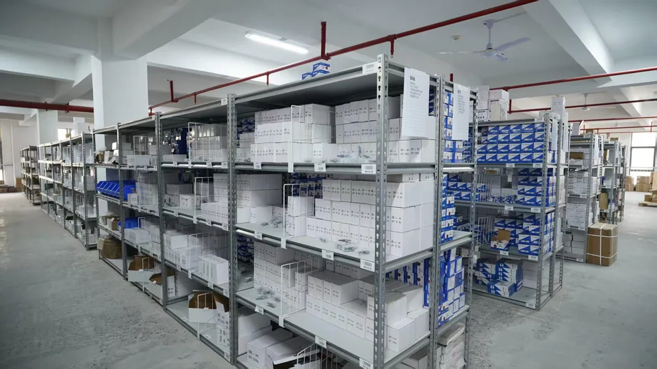Storage area with labelled shelving, boxes and parts bins
