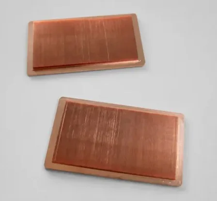 Project-supplied pair of copper-tone rectangular samples viewed from above