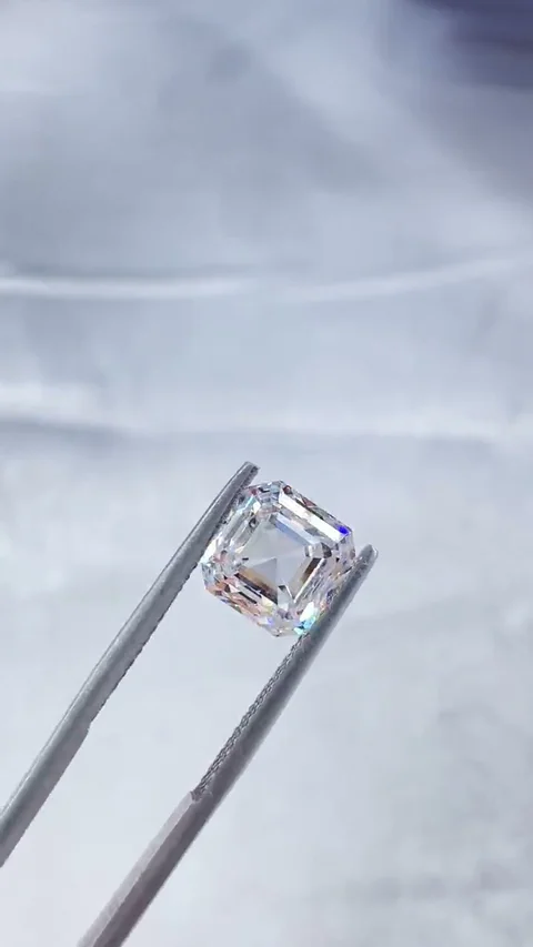 Asscher white diamond held in tweezers, extracted from supplied video