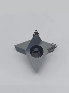 DiamovaLab single-crystal diamond inserts photographed on a light surface